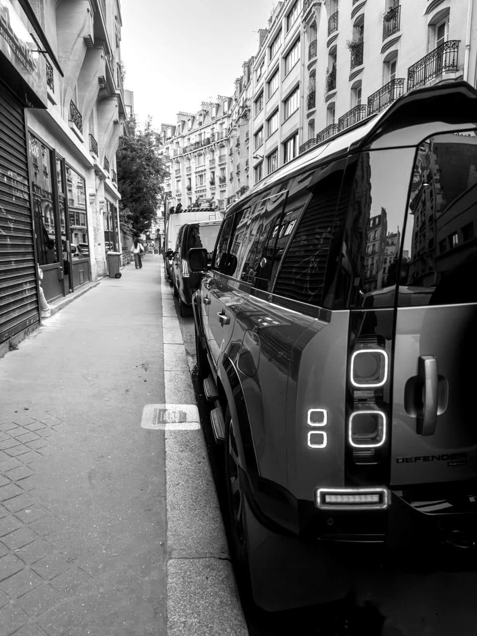 The rear of a BPS Defender parked on a city street