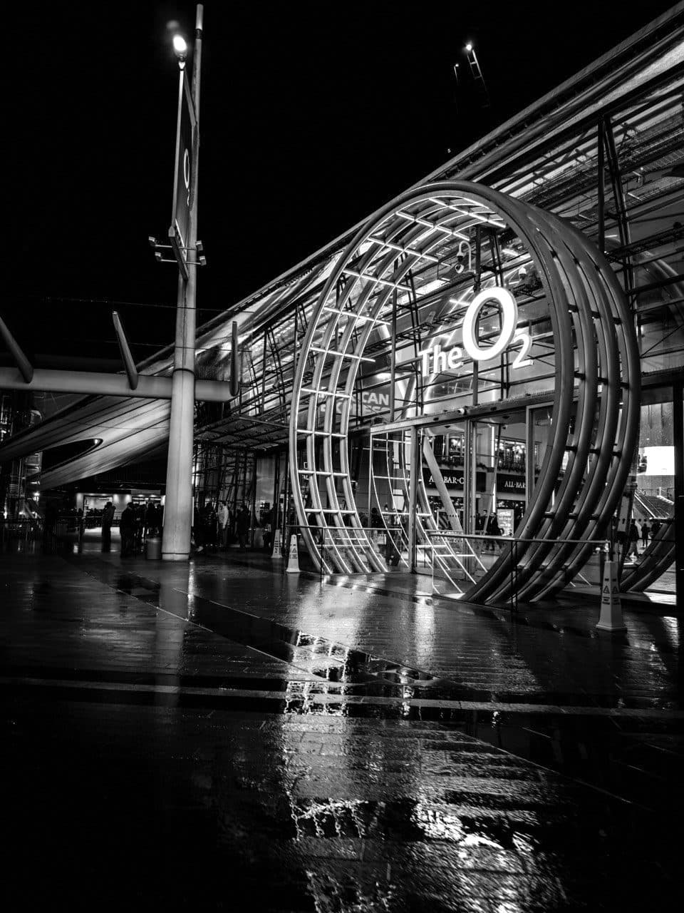 The O2 entrance at night after rain